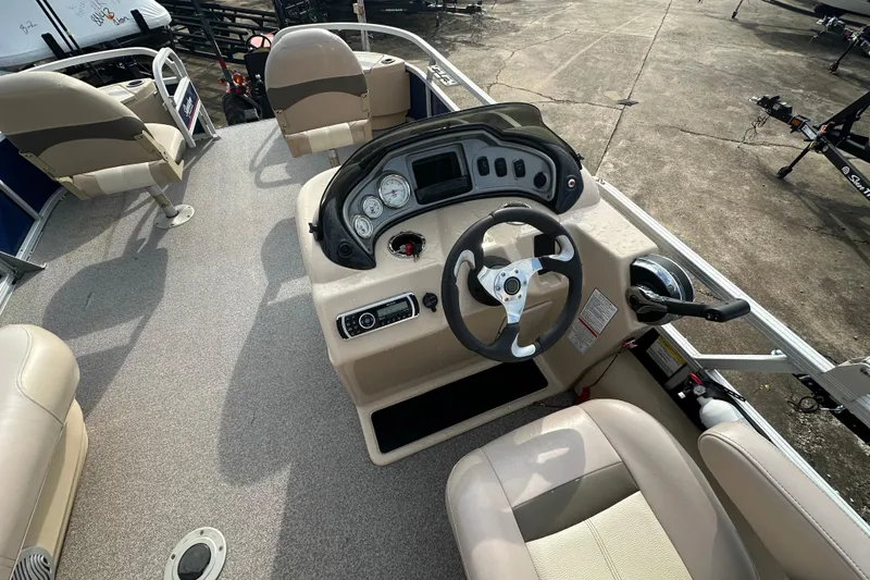 Slide: The Image of 2015 Sun Tracker Fishin' Barge 22 DLX interior with steering console and seating. - 13