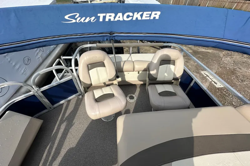 Slide: The Image of 2015 Sun Tracker Fishin' Barge 22 DLX interior with seating and canopy. - 9