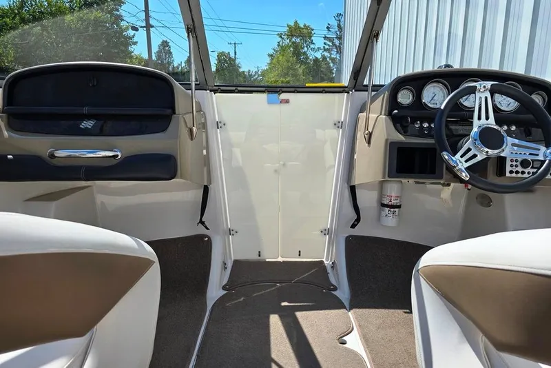 Slide: The Image of 2007 Four Winns 210 Horizon SS BR boat interior with steering wheel and dashboard. - 18