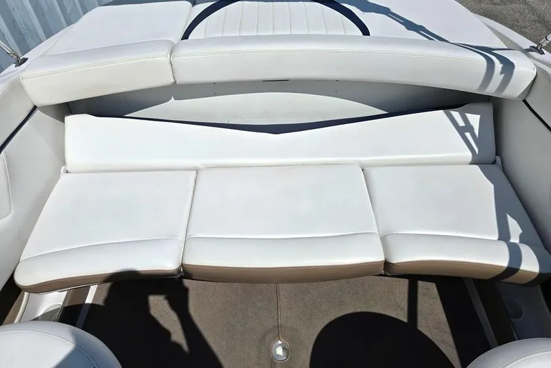 Slide: The Image of 2007 Four Winns 210 Horizon SS BR boat interior with white cushioned seating. - 6