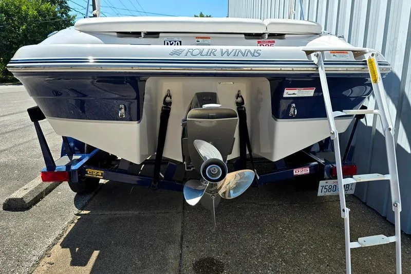 Slide: The Image of 2007 Four Winns 210 Horizon SS BR boat, rear view with propeller and ladder. - 9