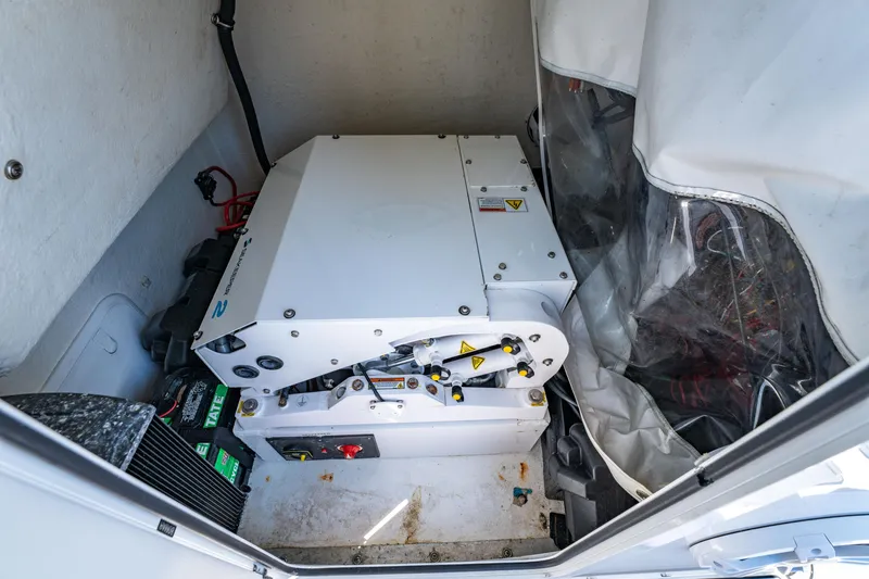 Slide: The Image of 2022 Twin Vee 280 GFX CC boat dashboard with navigation screens and controls. - 10