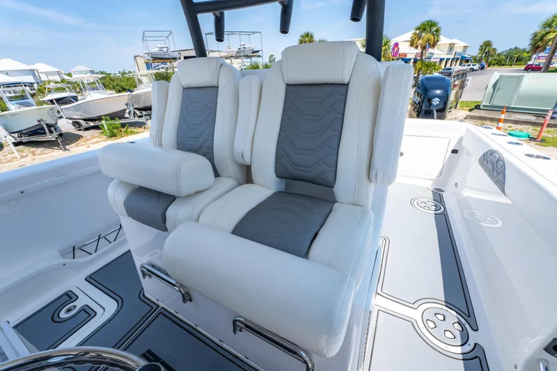 Slide: The Image of 2022 Twin Vee 280 GFX CC boat interior with dual cushioned seats. - 13