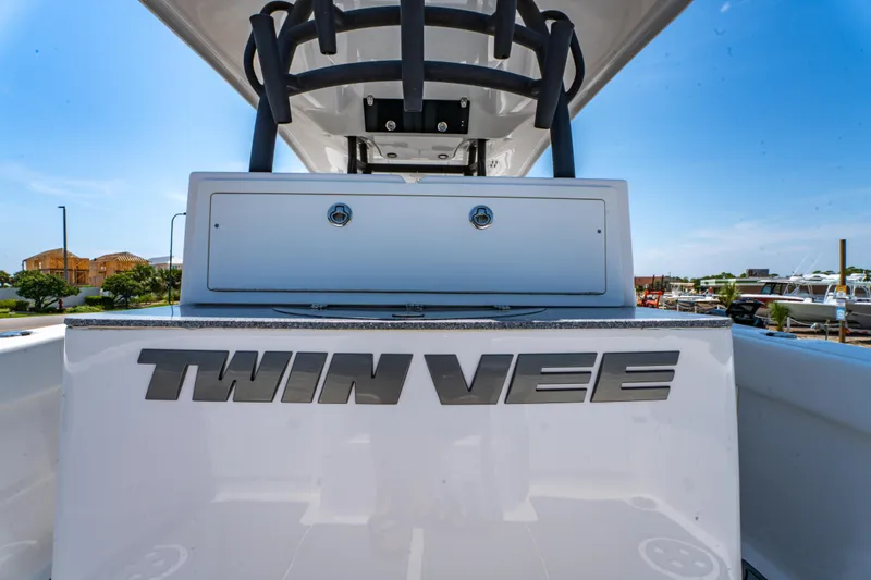 Slide: The Image of 2022 Twin Vee 280 GFX CC boat, rear view with logo, sunny day. - 18