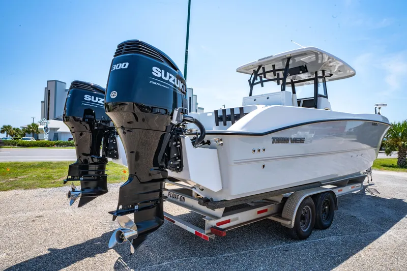 Slide: The Image of Engine compartment of 2022 Twin Vee 280 GFX CC boat with owner's manual. - 4