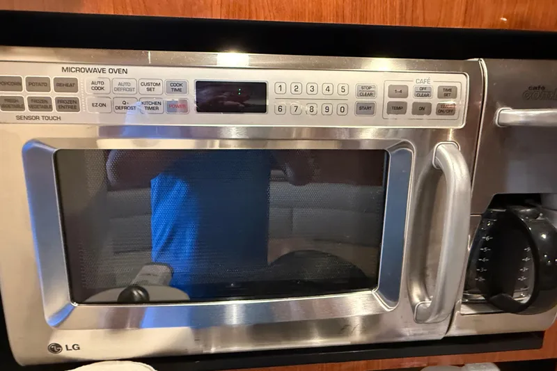 Slide: The Image of LG microwave oven inside a 2006 Sea Ray 340 Sundancer boat kitchen. - 12