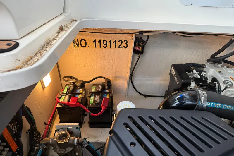 Slide: The Image of Engine compartment of 2006 Sea Ray 340 Sundancer with batteries and wiring. - 24