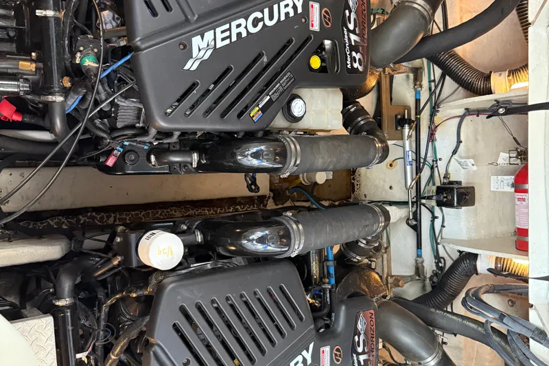 Slide: The Image of Engine room of 2006 Sea Ray 340 Sundancer with twin Mercury engines. - 25