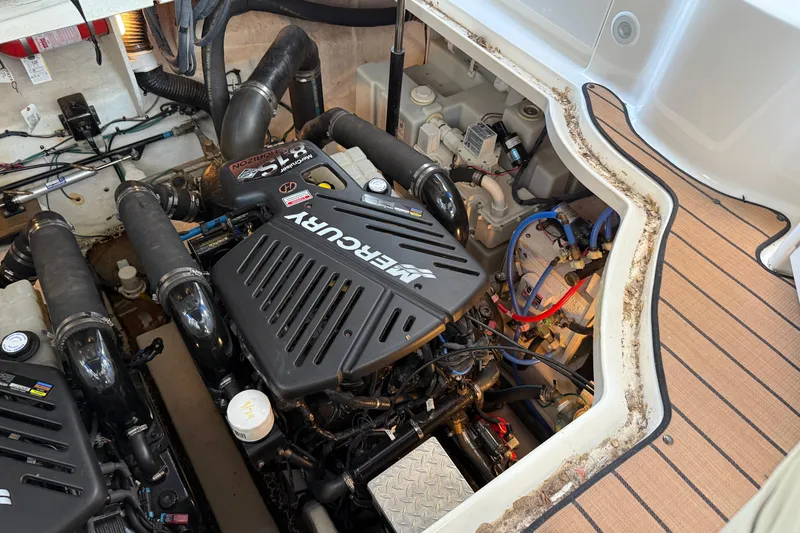 Slide: The Image of Engine compartment of 2006 Sea Ray 340 Sundancer with Mercury engine components. - 27