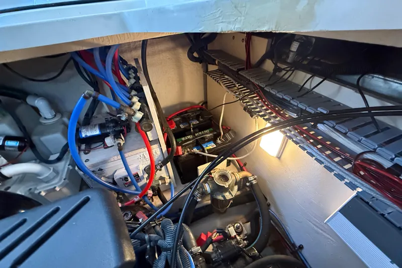 Slide: The Image of Engine compartment of a 2006 Sea Ray 340 Sundancer with visible wiring and components. - 29