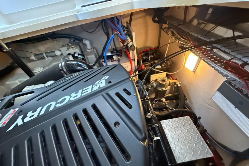 Slide: The Image of Engine compartment of a 2006 Sea Ray 340 Sundancer with a Mercury engine. - 30