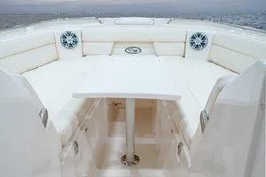 Slide: The Image of 2026 Grady-White Freedom 325 boat interior with seating and table. - 13