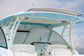 Slide: The Image of 2026 Grady-White Freedom 325 boat interior with seating and overhead canopy. - 3