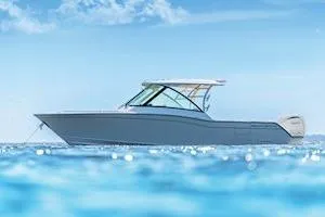 Slide: The Image of 2026 Grady-White Freedom 325 boat on clear blue ocean under sunny sky. - 4