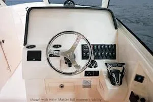 Slide: The Image of 2026 Grady-White Freedom 325 helm with advanced controls and steering wheel. - 7