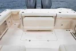 Slide: The Image of 2026 Grady-White Freedom 325 boat deck with seating, featuring a spacious and elegant design. - 9
