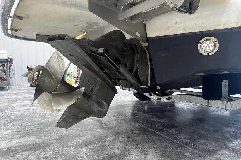 Slide: The Image of Rear view of a 2006 Cobalt 232 boat showing the propeller and stern drive. - 14