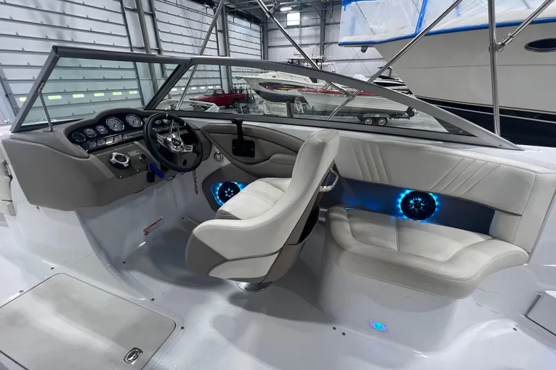 Slide: The Image of Interior of a 2006 Cobalt 232 boat with modern dashboard and seating. - 8