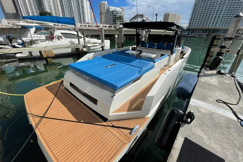 Slide: The Image of 2021 De Antonio Yachts Center Console docked, featuring sleek design and modern amenities. - 10