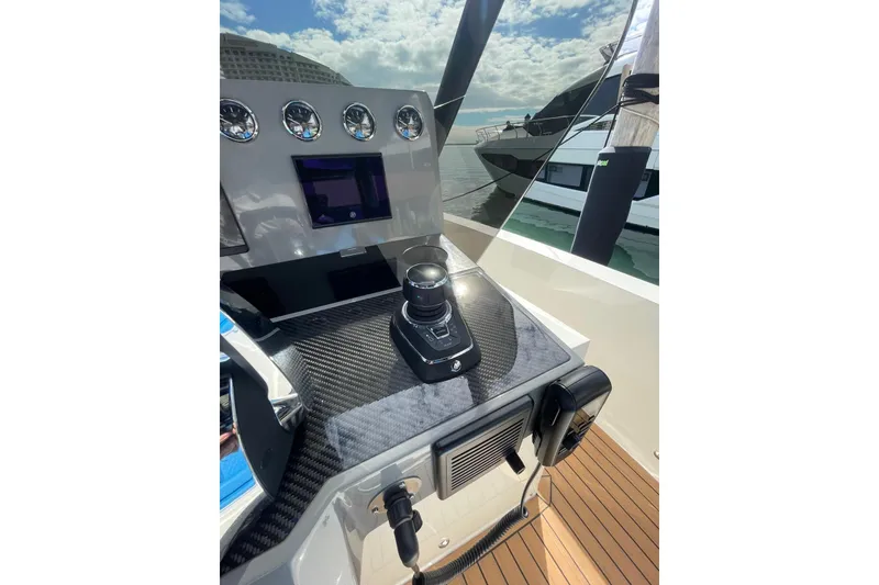 Slide: The Image of 2021 De Antonio Yachts Center Console helm with modern controls and sleek design. - 11