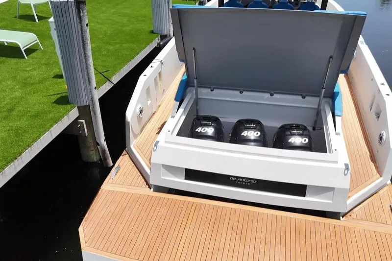 Slide: The Image of 2021 De Antonio Yachts Center Console with triple 400 horsepower engines at dock. - 21