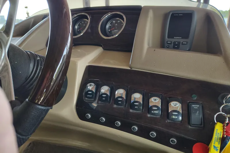 Slide: The Image of Dashboard of a 2014 Bennington 2575 QCW I/O boat with Garmin navigation system. - 21