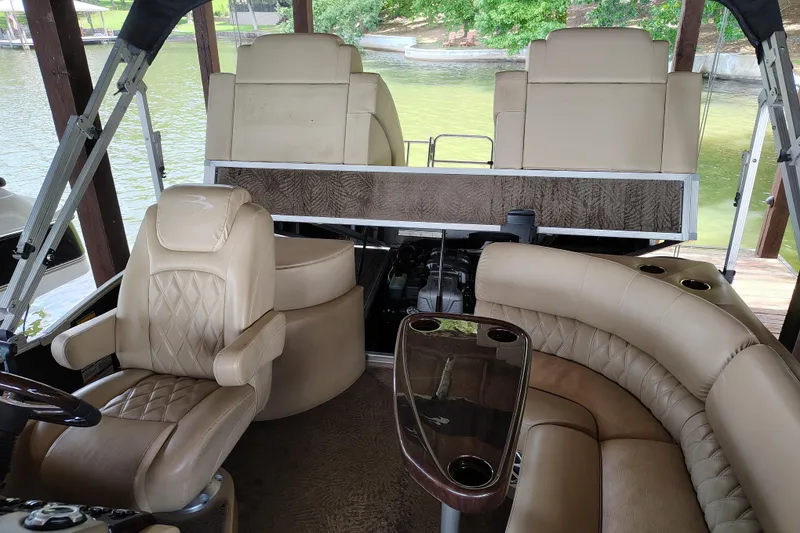 Slide: The Image of Luxurious interior of a 2014 Bennington 2575 QCW I/O pontoon boat with plush seating. - 36