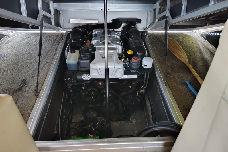 Slide: The Image of Engine compartment of a 2014 Bennington 2575 QCW I/O boat, showcasing internal components. - 39