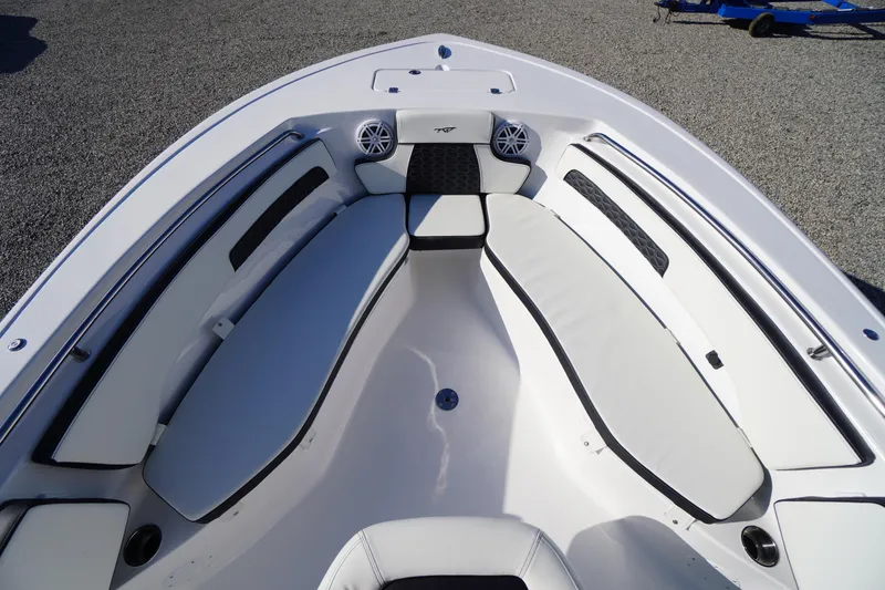 Slide: The Image of 2026 Tidewater 220 LXF boat interior with cushioned seating and speakers. - 10