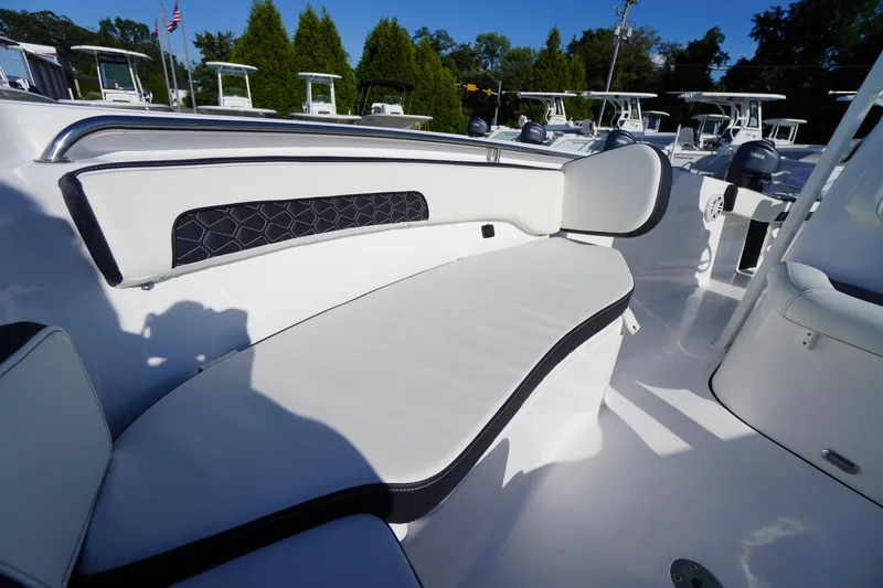 Slide: The Image of 2026 Tidewater 220 LXF boat interior with white cushioned seating and sleek design. - 12