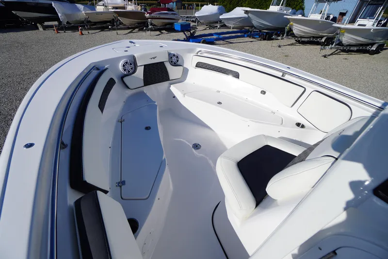 Slide: The Image of 2026 Tidewater 220 LXF boat interior with seating and storage compartments. - 14