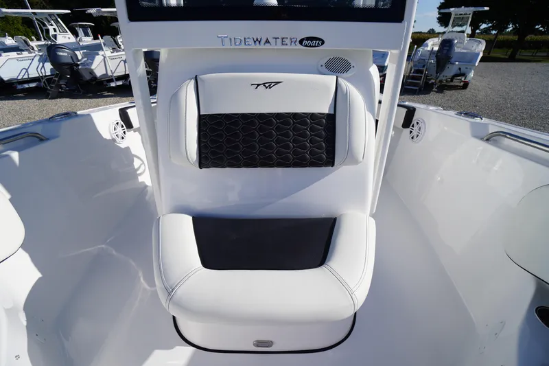 Slide: The Image of 2026 Tidewater 220 LXF boat interior with cushioned seating and sleek design. - 18