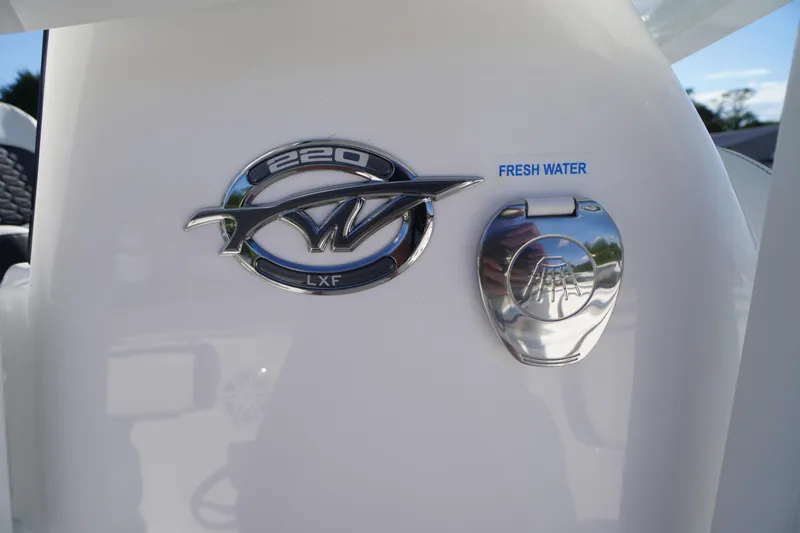 Slide: The Image of 2026 Tidewater 220 LXF boat emblem and fresh water access. - 35