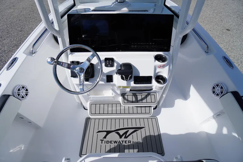 Slide: The Image of 2026 Tidewater 220 LXF boat cockpit with steering wheel and control panel. - 37