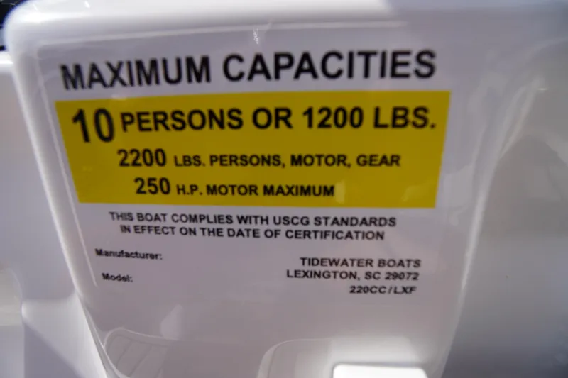 Slide: The Image of 2026 Tidewater 220 LXF boat capacity label, 10 persons or 1200 lbs, 250 HP motor. - 41