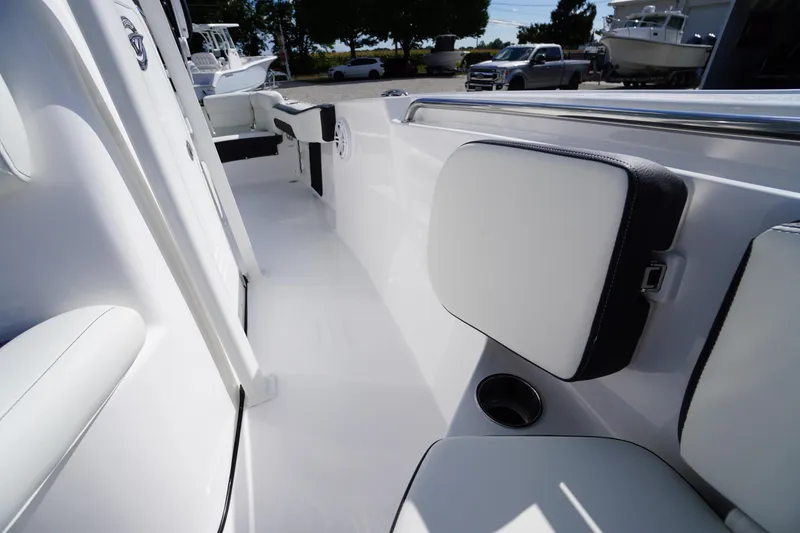 Slide: The Image of 2026 Tidewater 220 LXF boat interior with white seating and sleek design. - 42