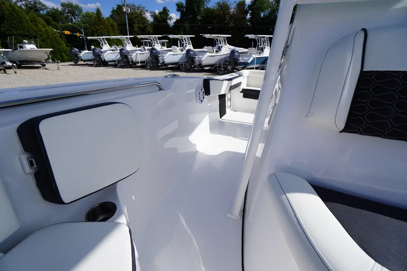 Slide: The Image of 2026 Tidewater 220 LXF boat interior with sleek white seating and modern design. - 43