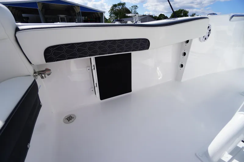 Slide: The Image of 2026 Tidewater 220 LXF boat interior, featuring sleek white seating and modern design elements. - 44
