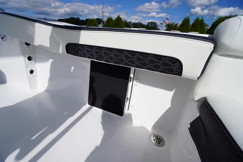 Slide: The Image of 2026 Tidewater 220 LXF boat interior, featuring sleek white and black seating design. - 45