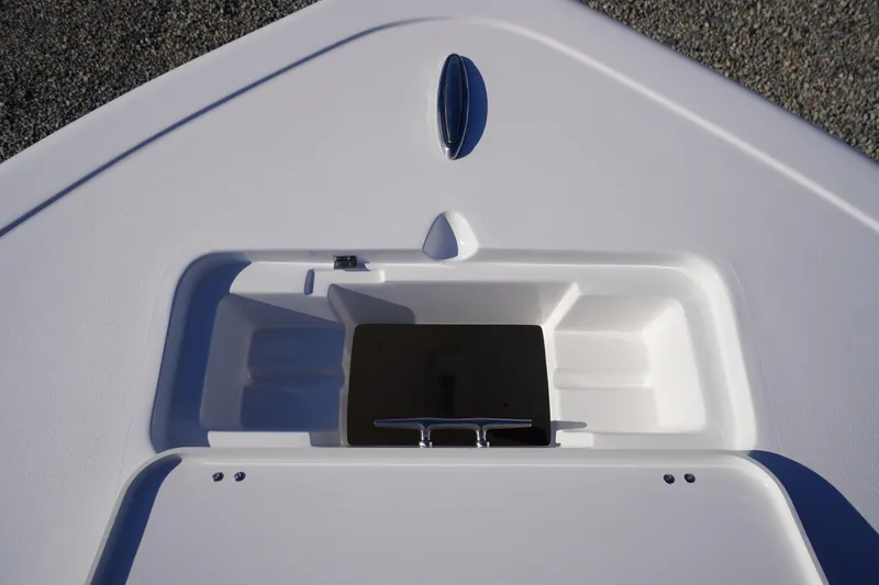 Slide: The Image of Bow storage compartment of 2026 Tidewater 220 LXF boat, featuring sleek design and cleat. - 5