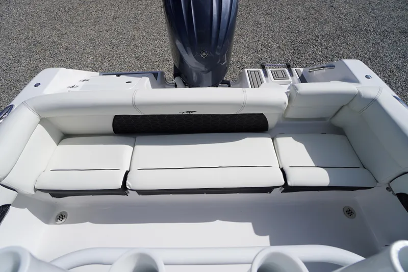 Slide: The Image of 2026 Tidewater 220 LXF boat with white cushioned seating and sleek design. - 52