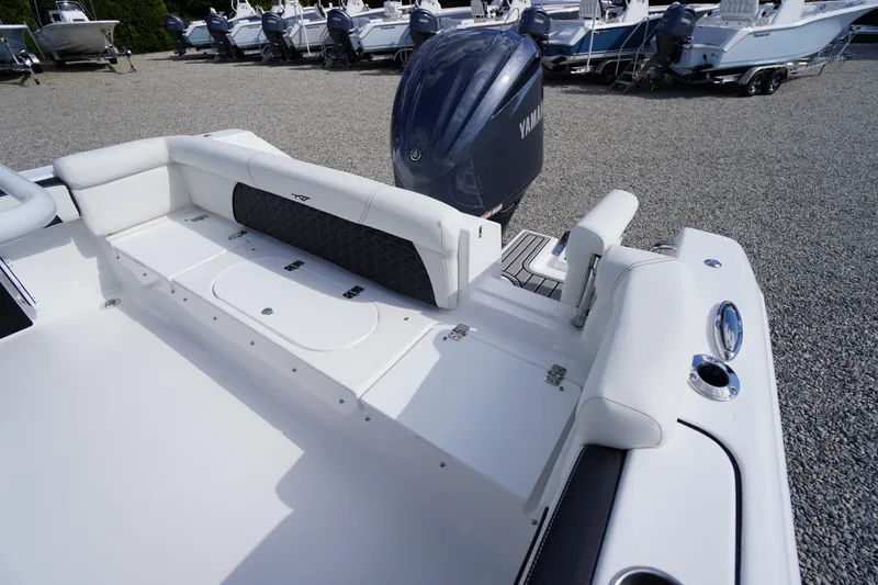 Slide: The Image of 2026 Tidewater 220 LXF boat with Yamaha engine, featuring spacious white seating and storage. - 56