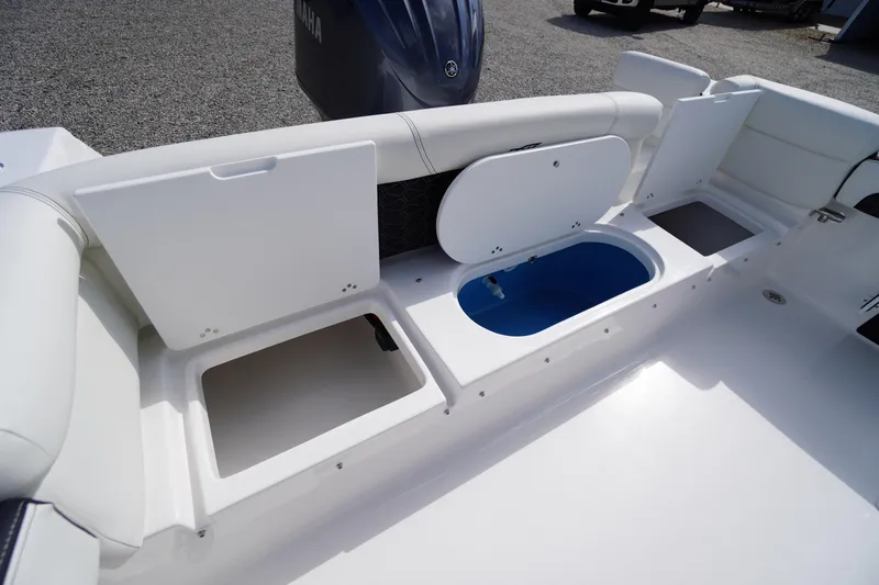 Slide: The Image of 2026 Tidewater 220 LXF boat interior with storage compartments and seating. - 59