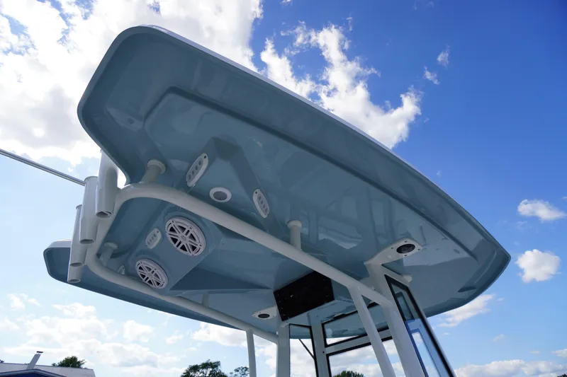 Slide: The Image of 2026 Tidewater 220 LXF boat canopy with speakers against a blue sky. - 67
