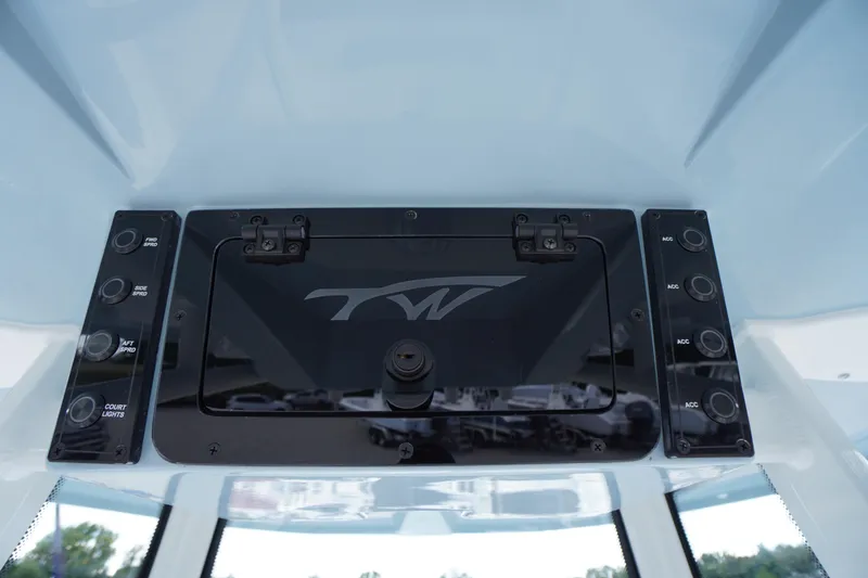 Slide: The Image of 2026 Tidewater 220 LXF boat dashboard with control panel and switches. - 68