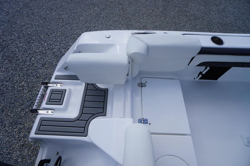Slide: The Image of 2026 Tidewater 220 LXF boat interior with white seating and non-slip flooring. - 70