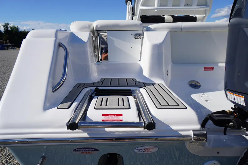 Slide: The Image of 2026 Tidewater 220 LXF boat stern with swim platform and ladder. - 77