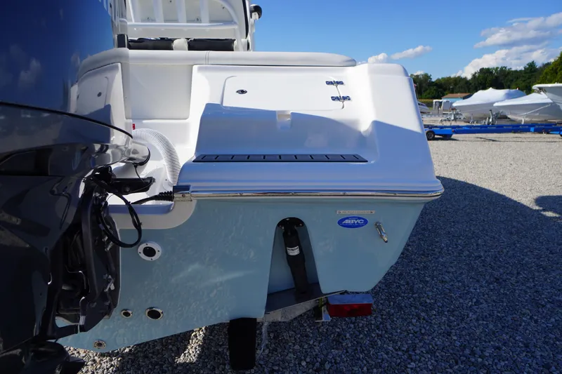 Slide: The Image of 2026 Tidewater 220 LXF boat rear view, showcasing sleek design and outboard motor. - 78