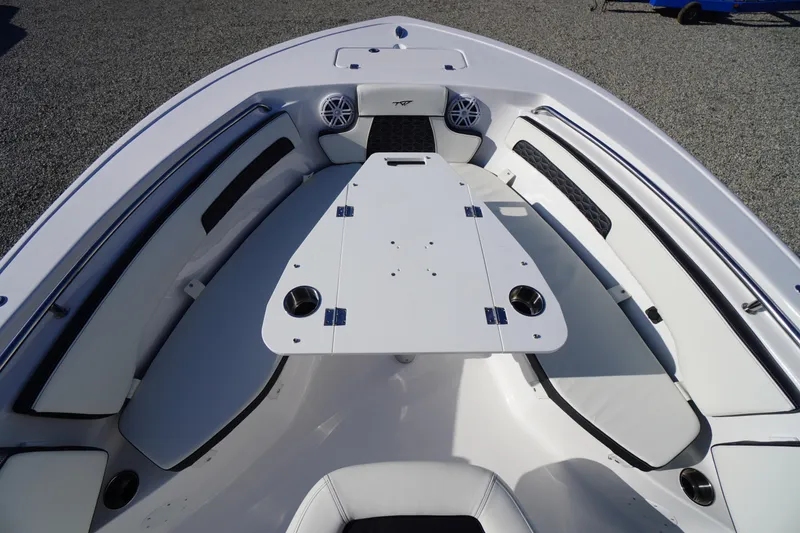 Slide: The Image of 2026 Tidewater 220 LXF boat interior with seating and table setup. - 8