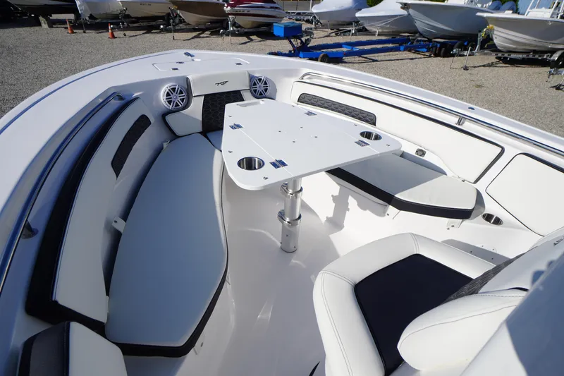 Slide: The Image of 2026 Tidewater 220 LXF boat interior with seating and table, showcasing modern design. - 9
